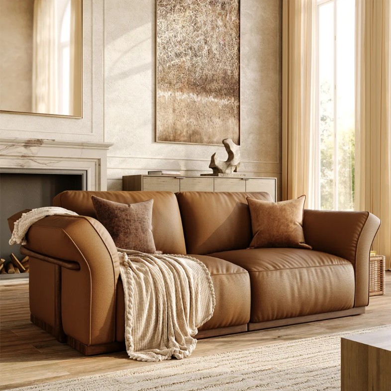 a brown leather sofa with cushions in a cozy living room