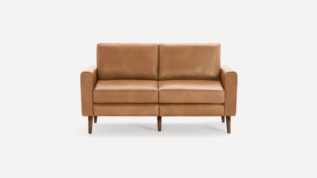 a brown leather loveseat fit in a small living room