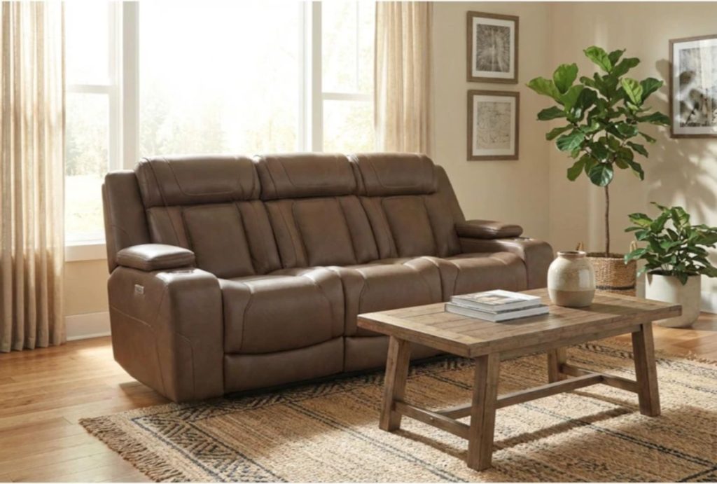 a brown leather Power Zero Gravity Reclining Sofa in a modern and cozy living room