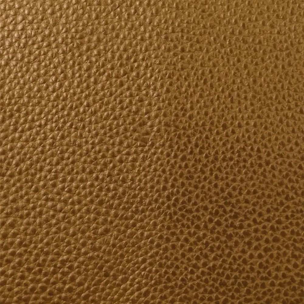 Brown top grain leather surface showing a smooth grain texture and natural leather pattern