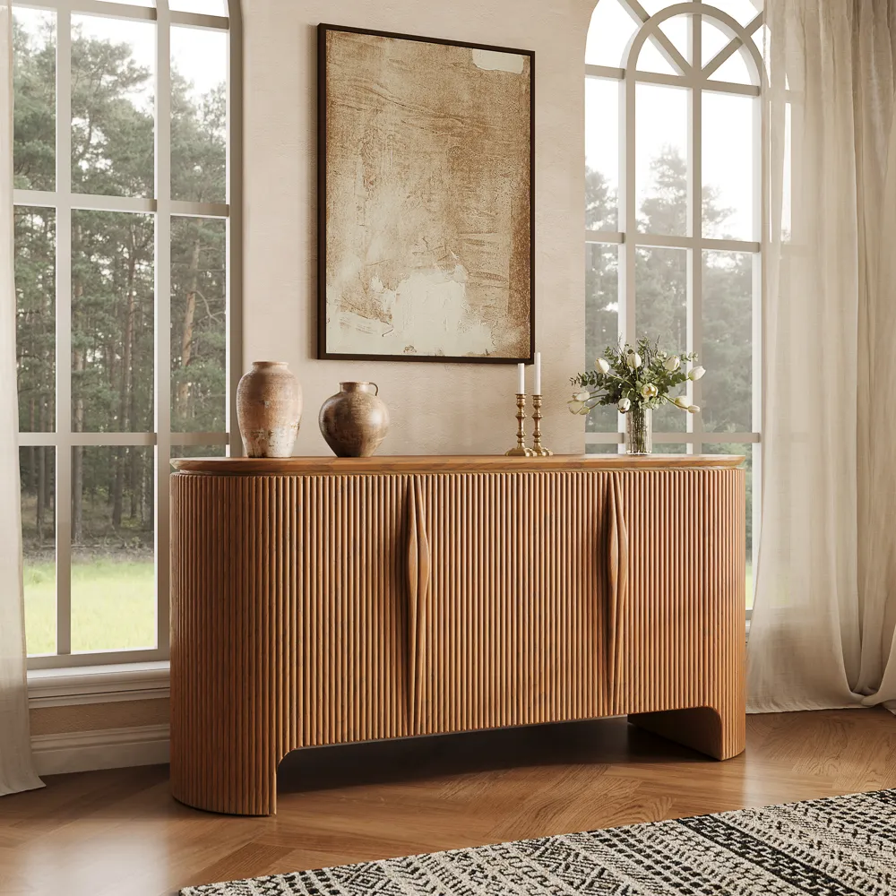 A walnut fluted storage cabinet below a large wall mirror, styled with ceramics, soft lighting, and a clean dining room backdrop.