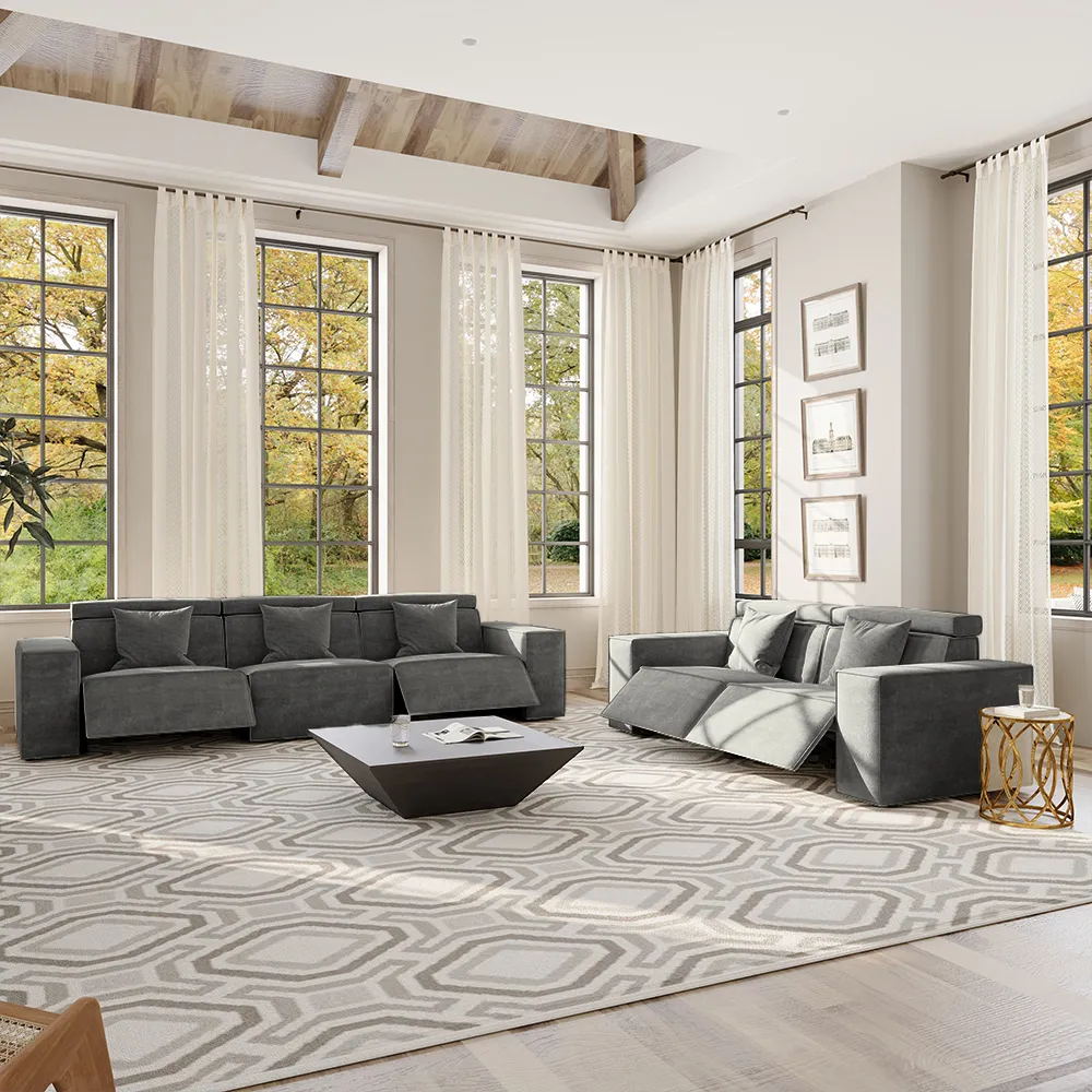 Dark gray modular reclining sofa in a contemporary living room, showing clean lines, deep seating, and a flexible layout.