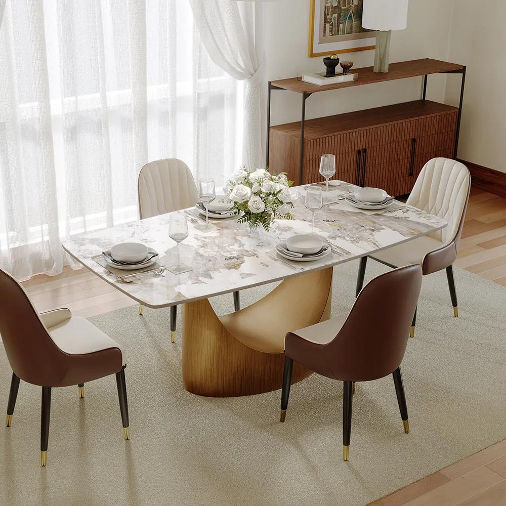 povison Hobart-Rectangular Sintered Stone Dining Table with plates, glass cups and a decoration on top in a cozy dining room