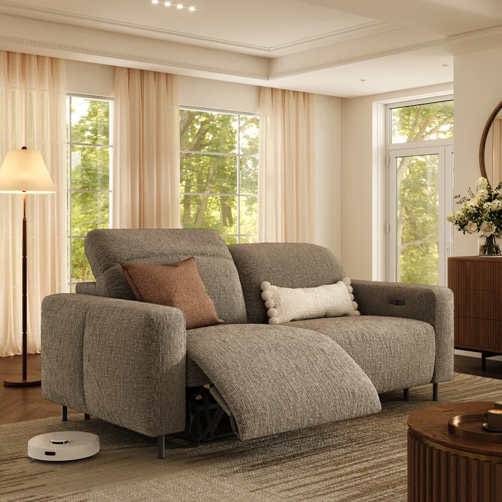 Modern reclining sofa in soft chenille fabric, placed in a calm living room with neutral decor and cozy lighting.