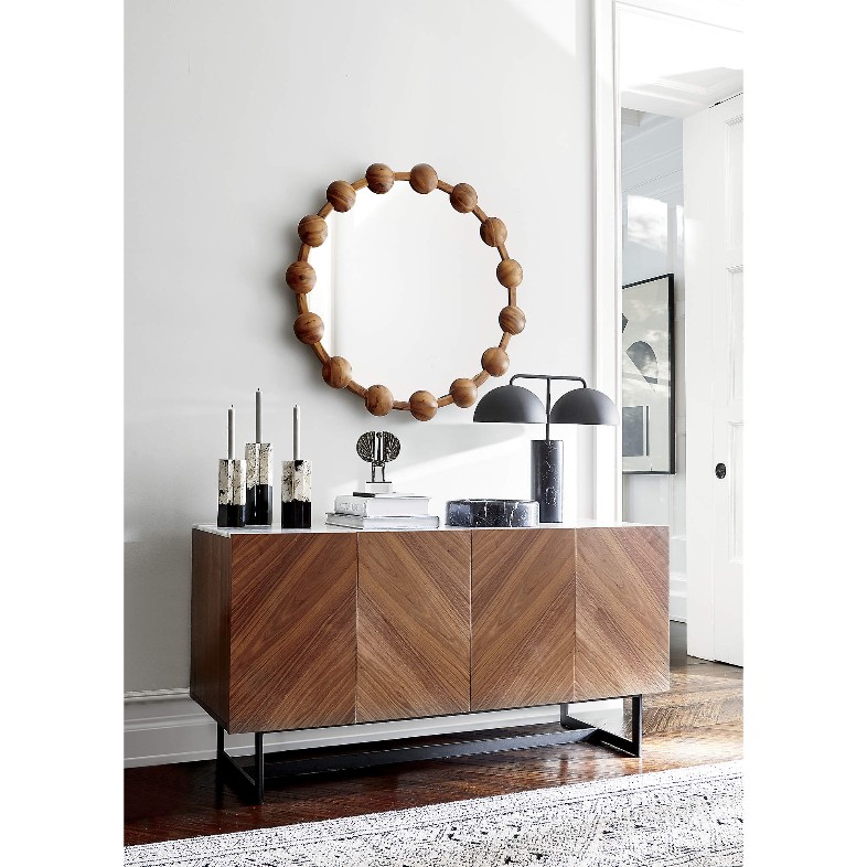 a CB2 Suspend Walnut Wood Media Console with White Marble Top, modern decorations and storage in a bright and stylish sitting room