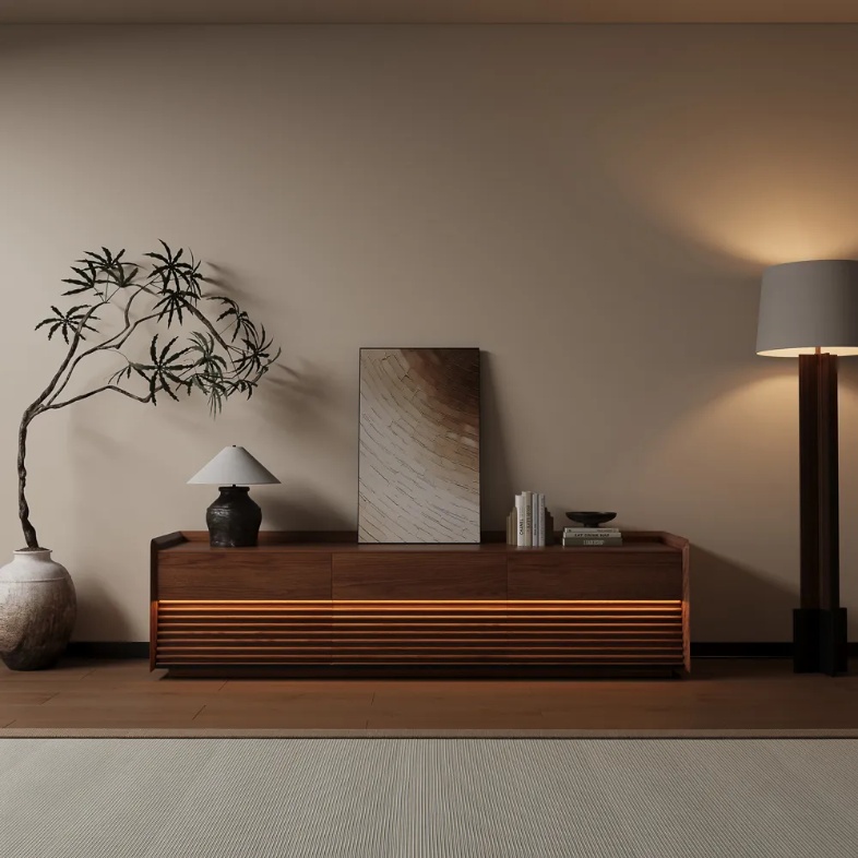 Povison Ansel-70.87'' Mid-Century TV Stand with led lights and storage and a lamp, books and a painting on top near a floor lamp and a plant in a warm living room