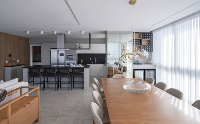 A cohesive kitchen and dining area, with repeated colors and materials helping the space feel visually connected.