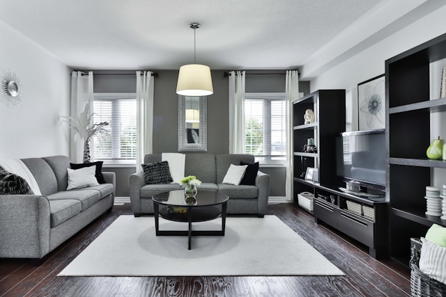 A open gray and white living room layout with clean lines and neutral colors 
