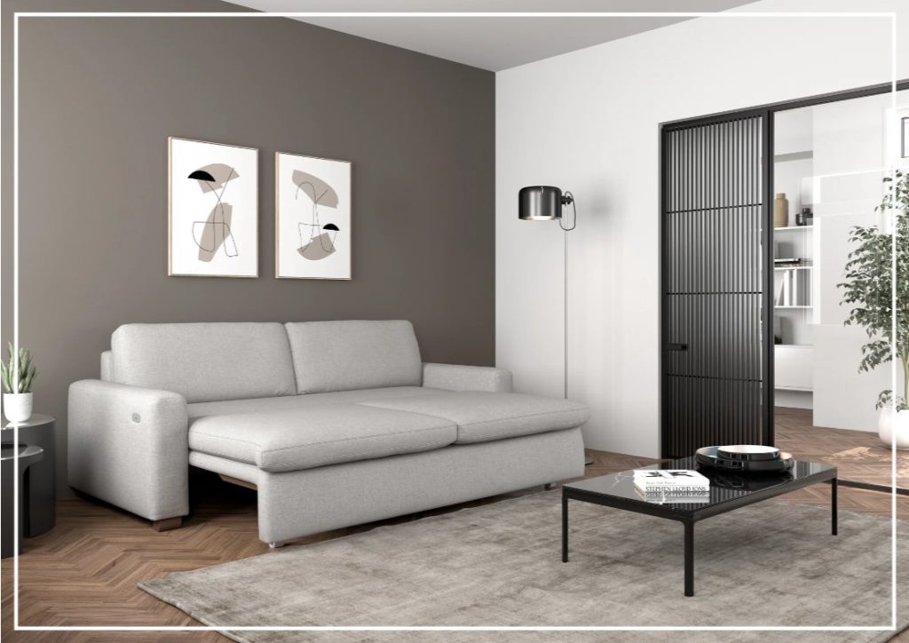 a grey Luonto Kai Full Size power sofa bed with motorized slide function near a side table, a floor lamp and a rectangular glass coffee table in a compact and minimalist living room