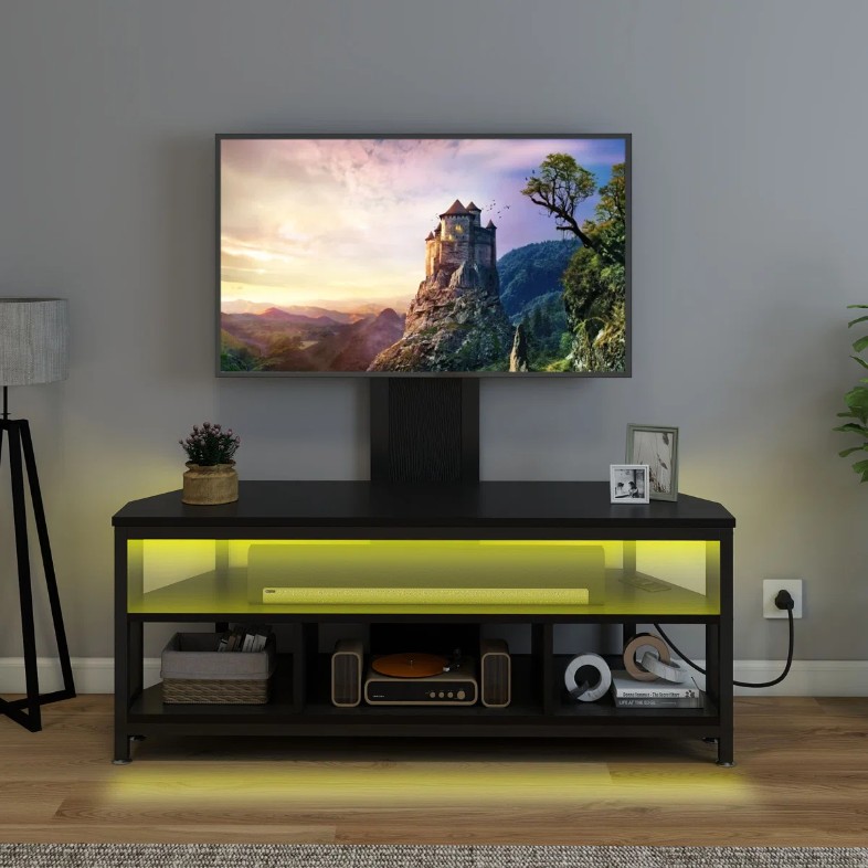 a Wade Logan Chardell LED Height Adjustable TV Stand with decorations and storage for media and soundbar in a living room