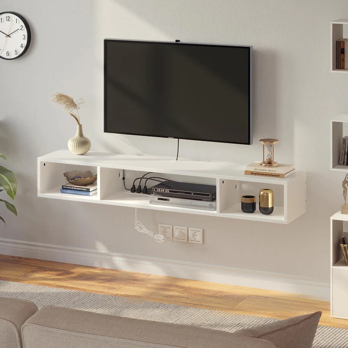 Rolanstar 55.1'' Floating TV Stand with Power Outlet & RGB Lights and storage for books, media and decorations near a wall-mounted tv in a modern and minimalist living room