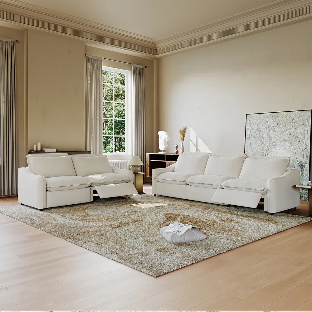 Ergopals-Power Reclining Sofa in white near a side table with a lamp on top in a bright and modern living room
