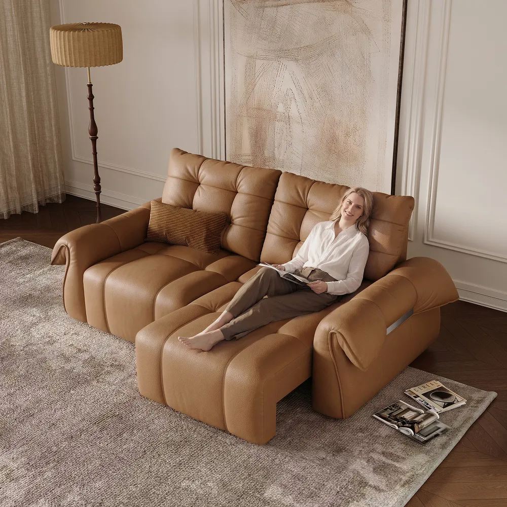 Povison Cygnus-Power sofa bed with motorized functions with a woman reclining on it near a floor lamp in a minimalist living room