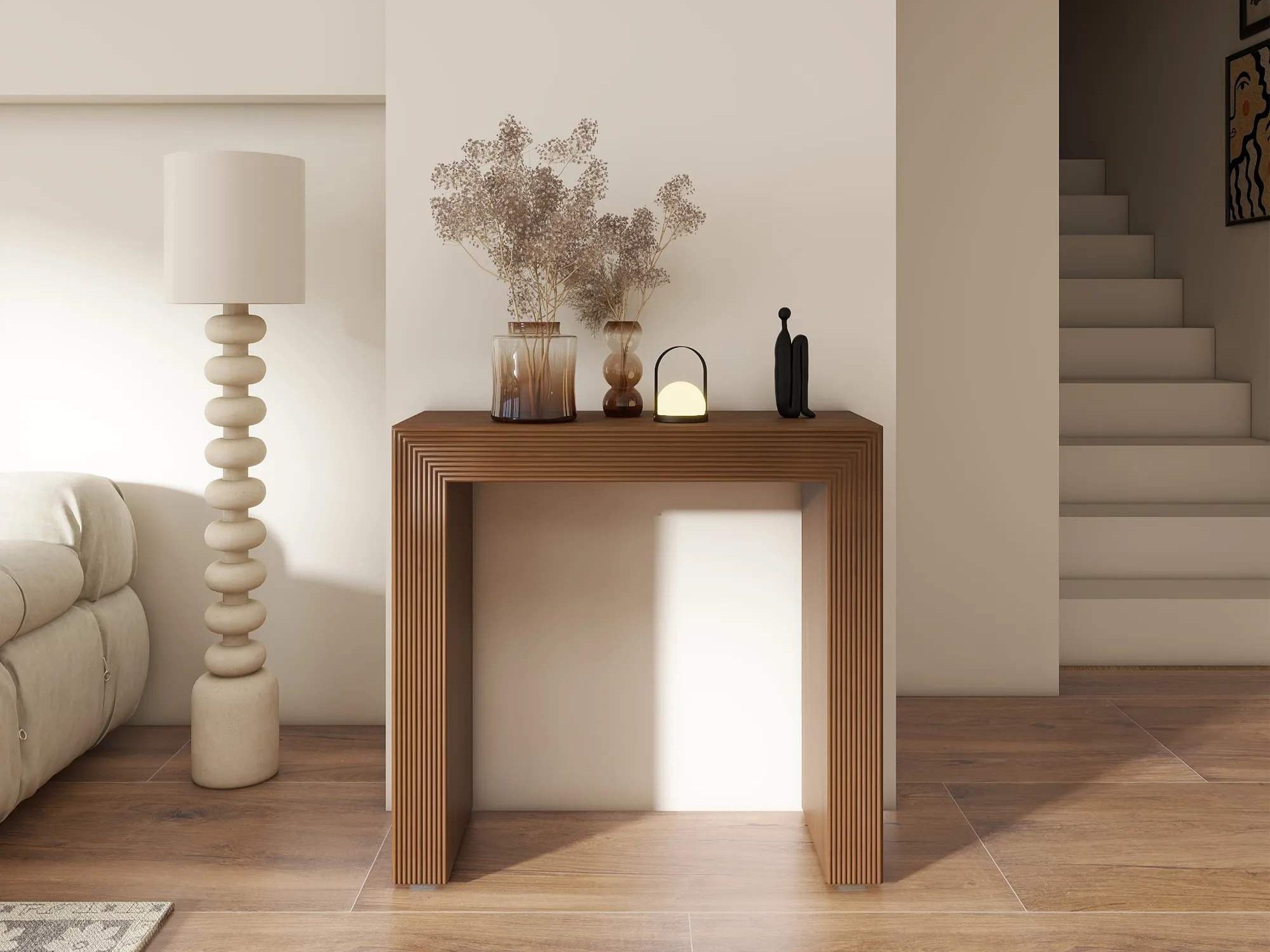 a wood console table with plants and decorations on top in a minimalist modern farmhouse