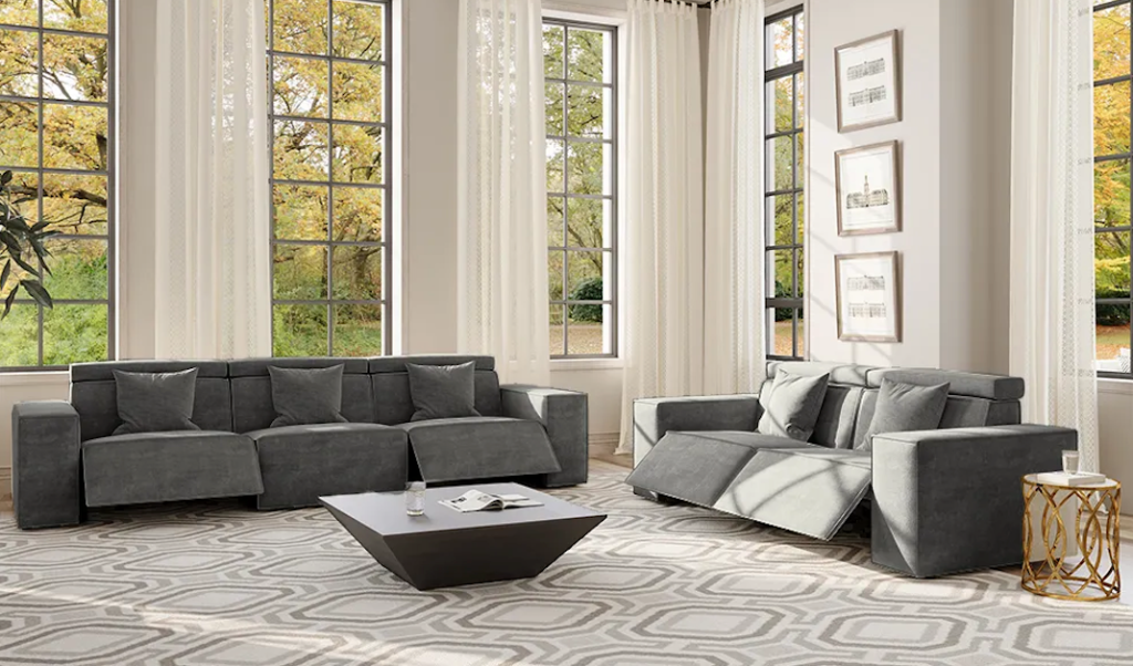 Premium charcoal grey fabric recliner sofa sets with adjustable leg rests in a bright, airy apartment.
