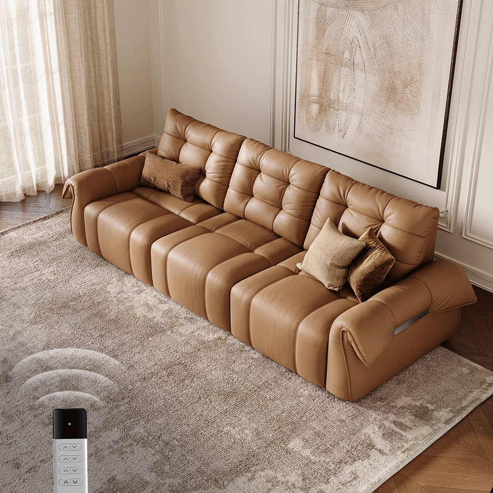 Contemporary leather sofa in a bright living room with controlled natural light, neutral decor, and open space around the seating.