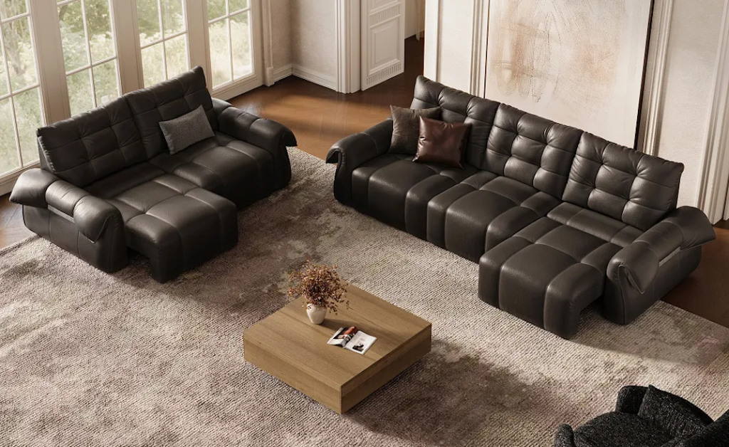 Two dark brown tufted leather modular sofa beds for small spaces with extended footrests placed on a classic rug.