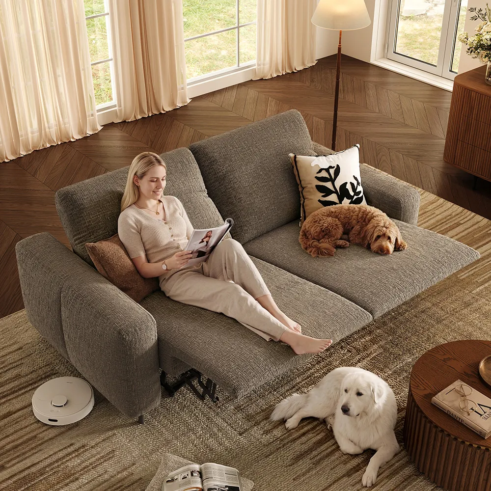 Khaki dual power reclining loveseat with low side pillows, keeping the headrest, footrest, and arm controls visually clear.