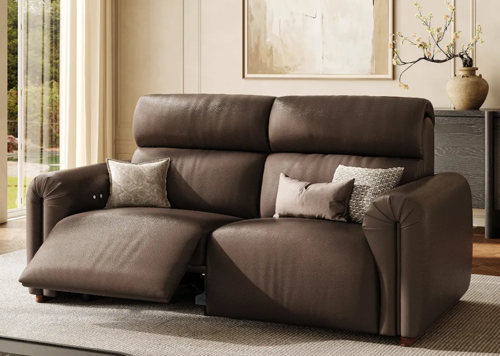 Premium dark brown leather power lift recliners designed as a luxury double sofa with plush tufted backrests.