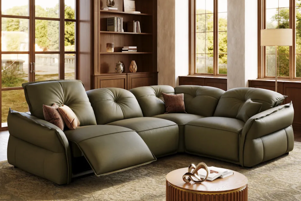 Sleek off-white leather power reclining sectionals arranged in a modern interior with minimalist decor.