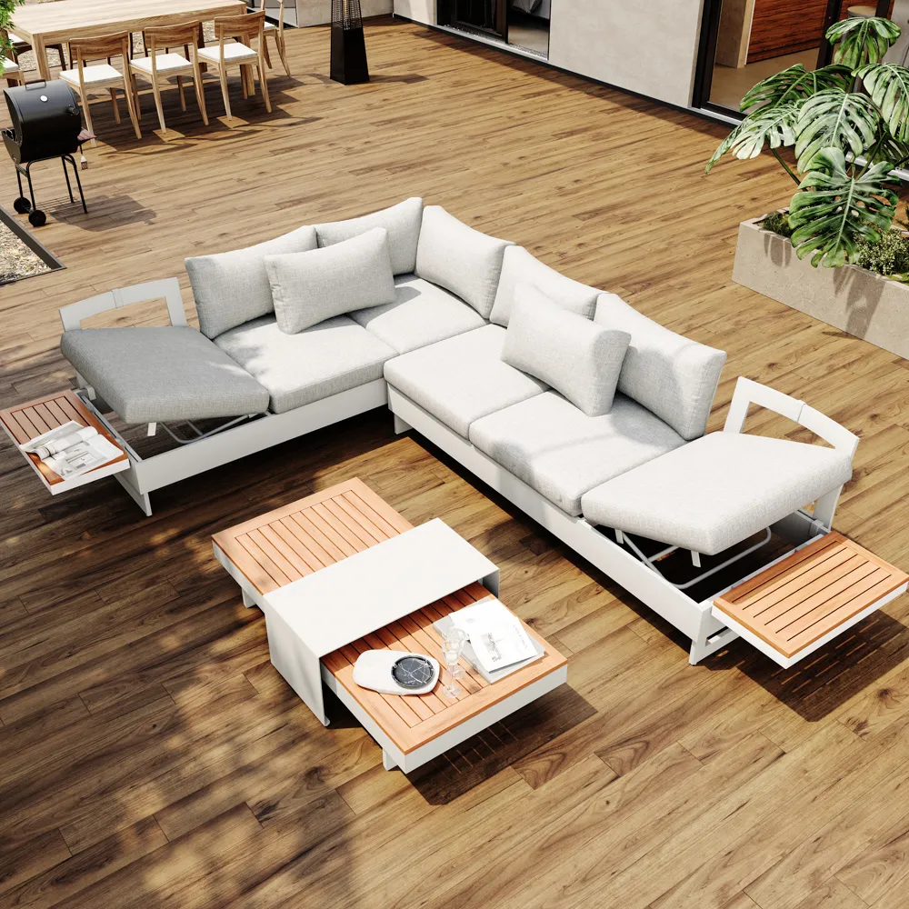 A modern three-seat outdoor sofa with gray cushions, side table, and clean metal frame for a covered patio setting.