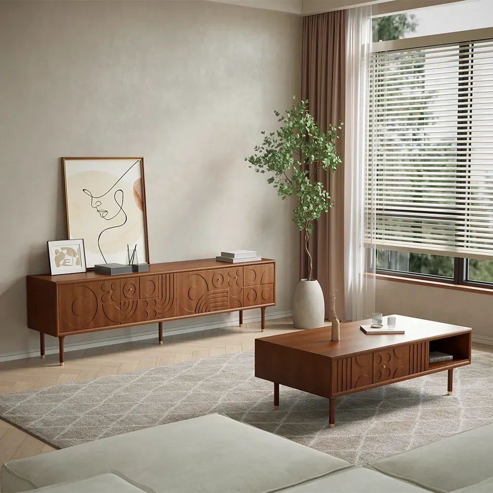 Warm walnut TV console and matching coffee table in a calm lake home living room with low seating and open window views.