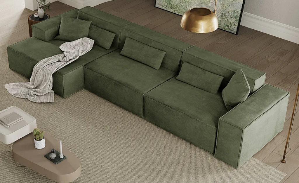 Top-down view of an olive green fabric modular sofa bed for small spaces arranged on a minimalist beige floor rug.