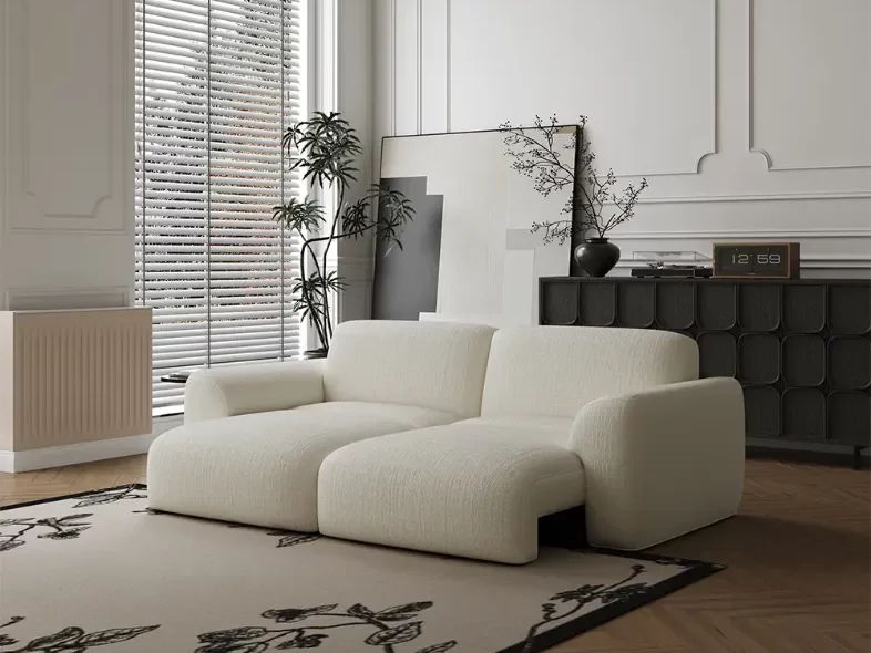 Povison Aurora Power Sofa Bed with pet-friendly fabric for pet owners near a wood console table in a living room