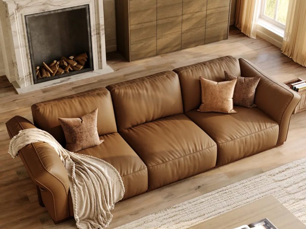 Cronus-Brown Genuine Leather Modular Sofa with Solid Wood Frame near a rectangular wood coffee table, a wood console table and a fireplace in a bright living room