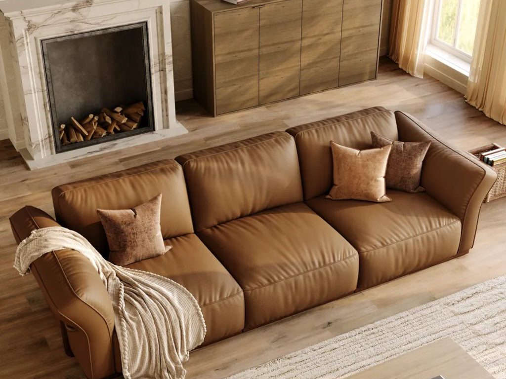 cronus-brown modular leather sofa with 3 seaters near a rectangular wood coffee table, a wood console table and a fireplace in a cozy and warm living room