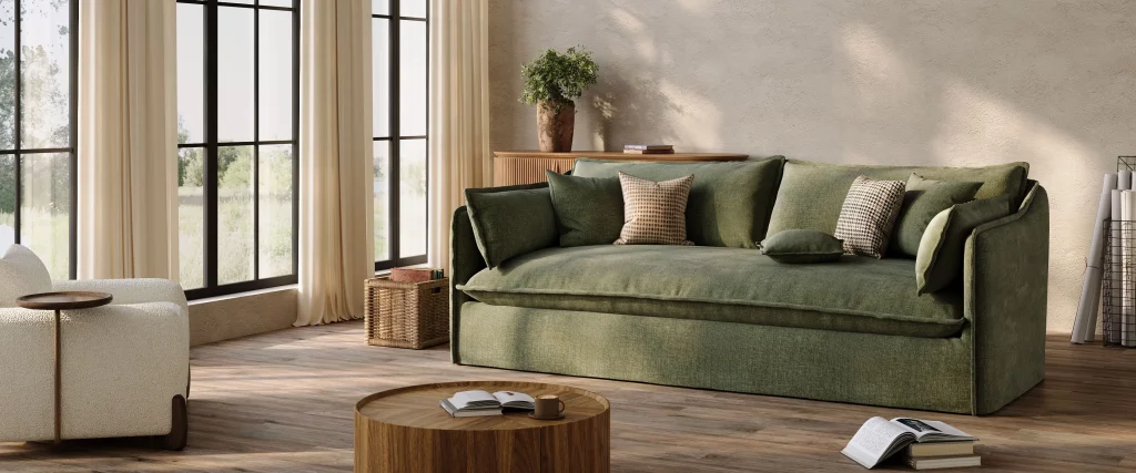Deep neutral sofa with removable covers in a relaxed lake living room, paired with wood accents and washable textured pillows.