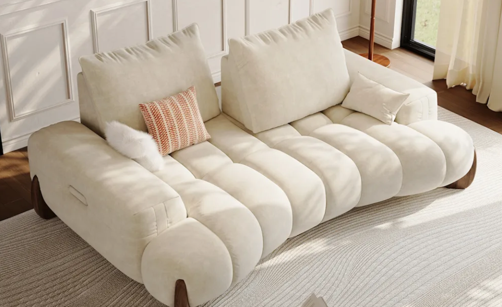 Avant-garde channeled cream boucle loveseat sofa for small spaces resting on a textured minimal rug.