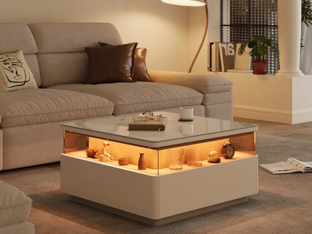 Modern living room with a beige sectional sofa and illuminated square coffee table featuring a marble top, open display shelf, and warm ambient lighting.
