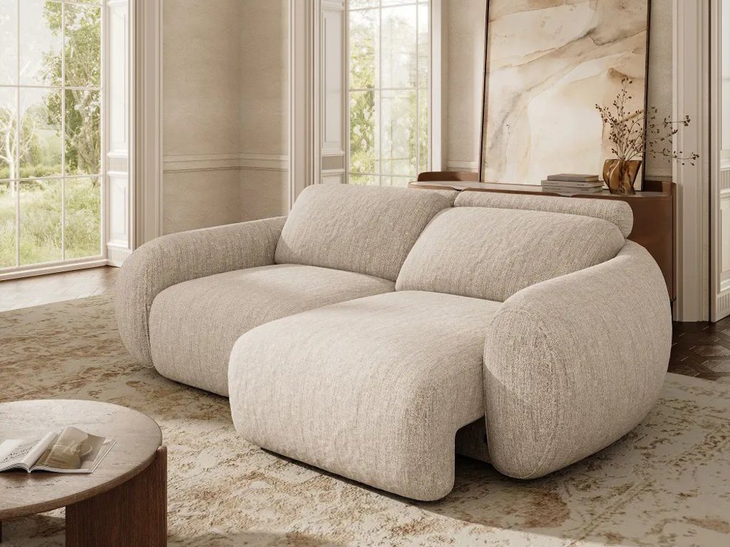 Cream power sofa bed with one seat extended in a bright, elegant living room.