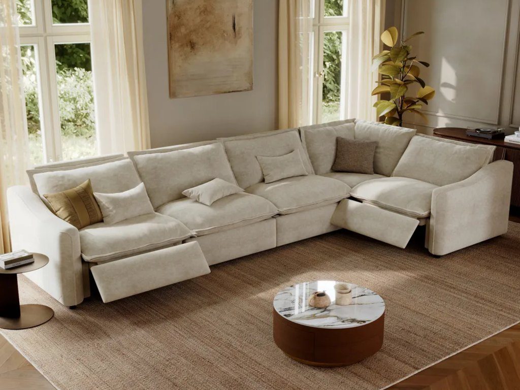 Cream sectional sofa with built-in recliners, a round marble-top coffee table, and a large area rug in a bright living room.