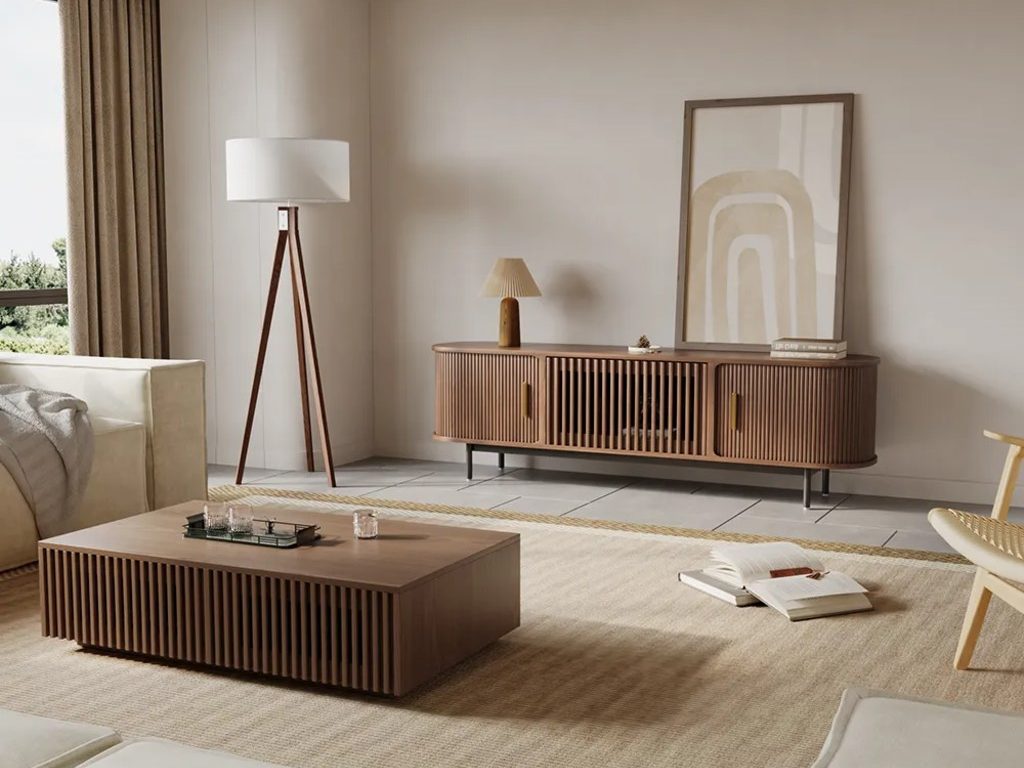 Warm minimalist living room with wood TV stand, matching coffee table, neutral sofa, textured rug, and layered soft lighting.