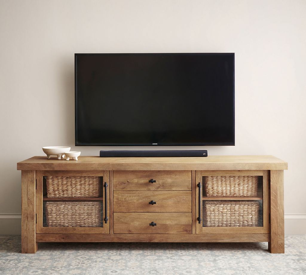 Pottery Barn Oakleigh 80" Media Console with drawers and storage, a soundbar and some trays on top below a wall mounted tv