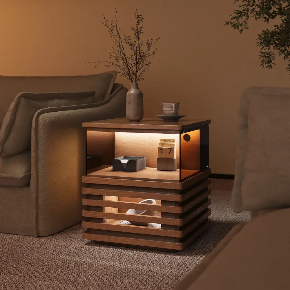 Selene-18" Slatted Side Table with LED Lights, a glass, a vase and decorations beside a grey sofa in a cozy and warm living room