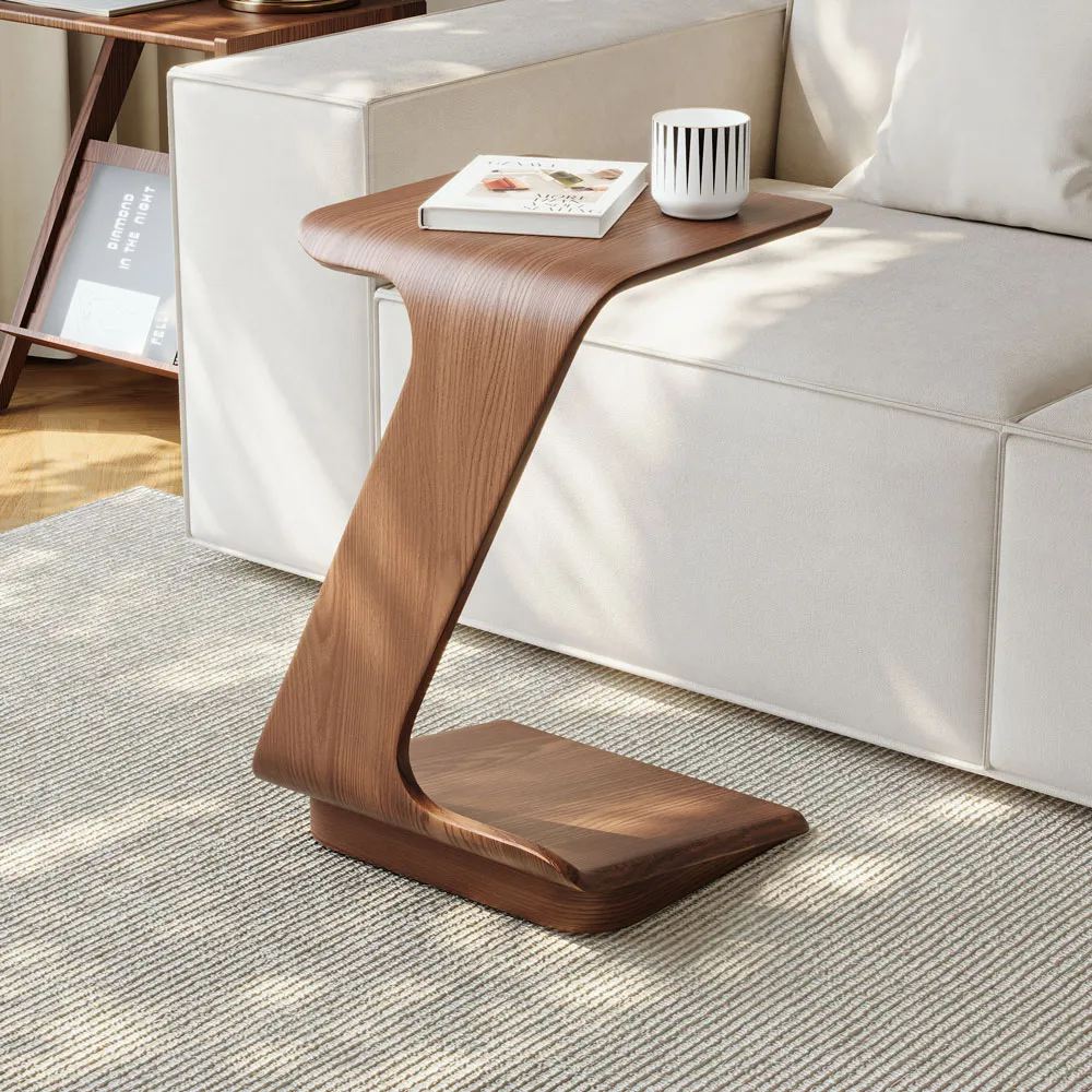 2 PCS 15" Modern C-Shaped Side Table with Wheels, a cup and a book are placed on top near a white sofa with square arms