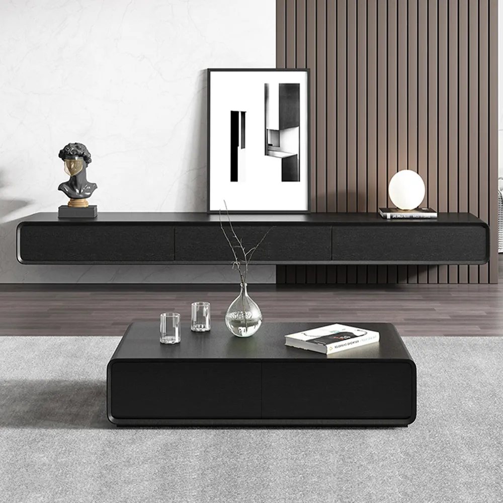 Merrin-63" Black Floating TV Stand with a statue, a painting and a book on top near a black and low coffee table in a modern and minimalist living room