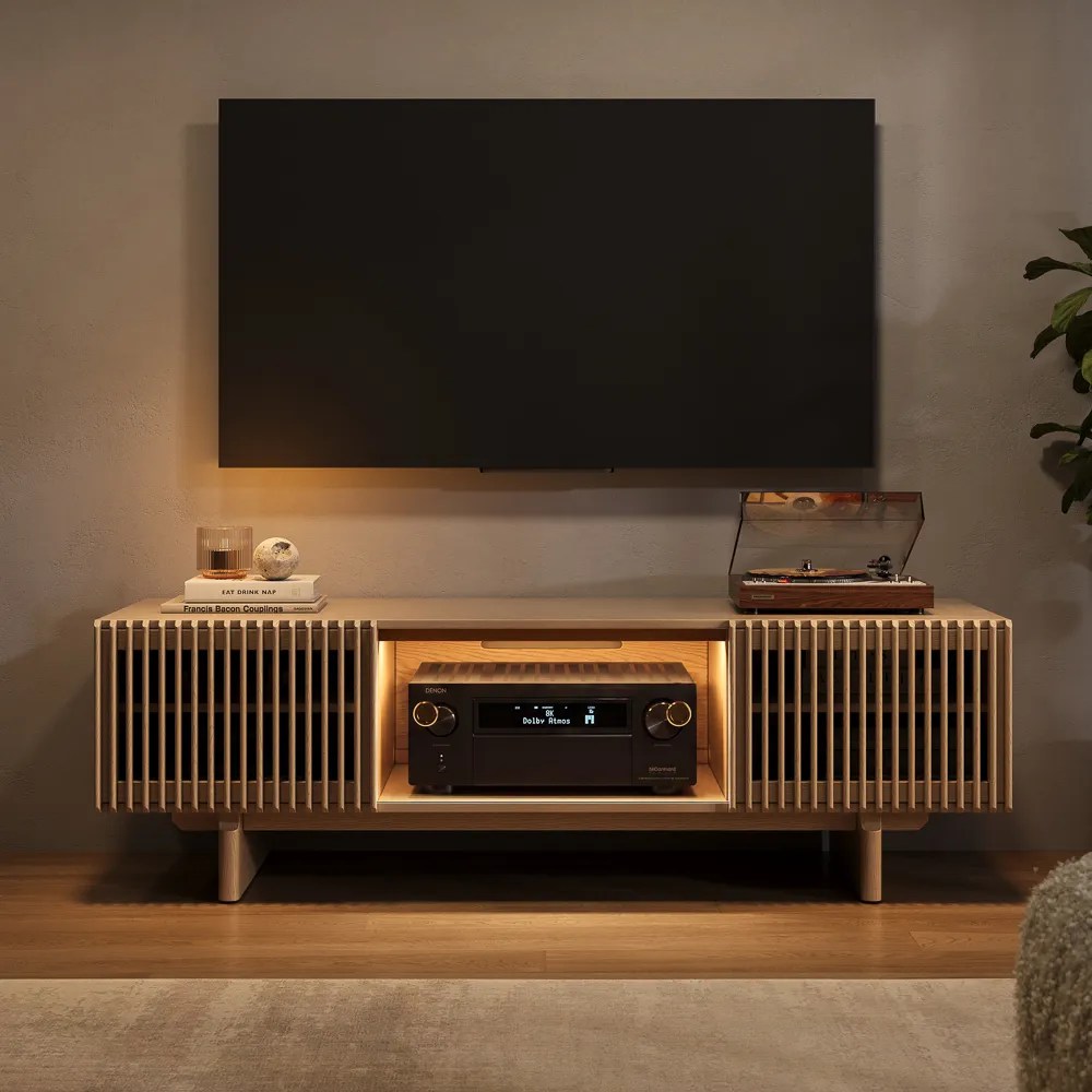 Arboren-22“ Deep Slatted Media Console with Large Storage for media and soundbars, some books and a disc player on top below a wall-mounted tv in a cozy and warm living room