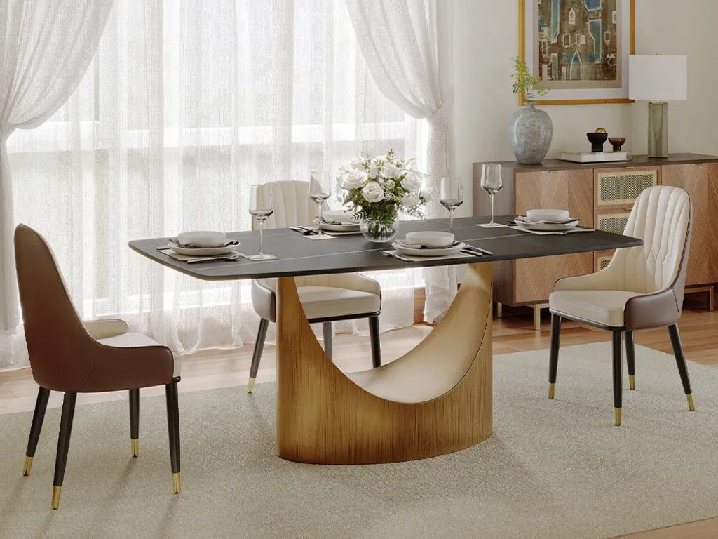 Hobart-Rectangular Sintered Stone Dining Table with marble top and metal leg with 3 chairs near a wood storage cabinet with decorations on top in a modern and bright living room