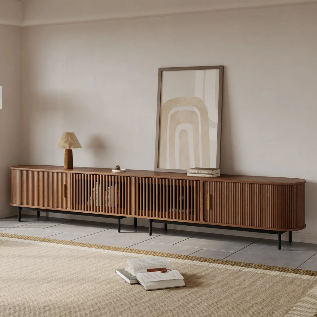 POVISON Eos-118.11"Mid-Century Modern Tambour Door TV Stand with a lamp, a painting and some books on top in a minimalist living room