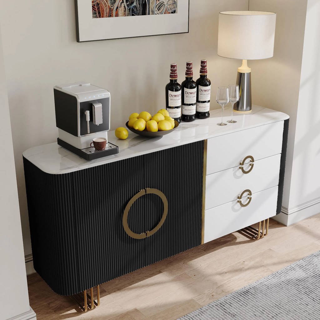 Modern black and white sideboard with marble top, gold handles, fluted cabinet doors, table lamp, coffee machine, and decorative bar setup.