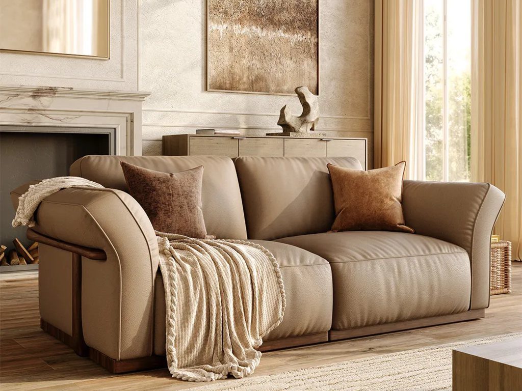 Cronus-Khaki Genuine Leather Modular Sofa with Solid Wood Frame and cushions near a rectangular wood coffee tablem a wood console table and a fireplace in a living room