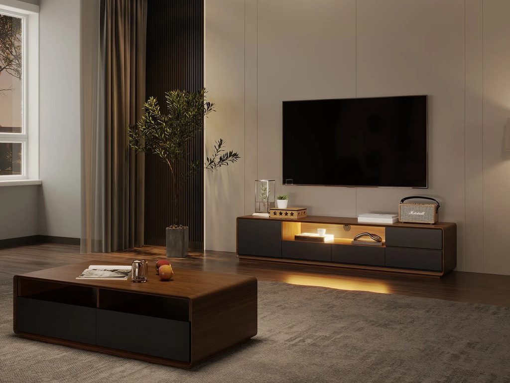 a wood black coffee table above a rug near a wood black tv stand with drawers, warm LED lights and storage for consoles against a white wall in a minimalist living room
