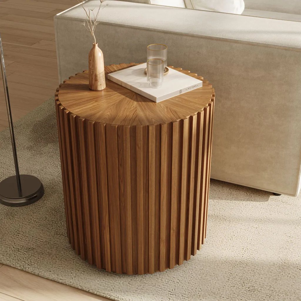 Silva-20" Fluted Round End Table with a book, two cups and a vase on top near a floor lamp and a white sofa with square arms