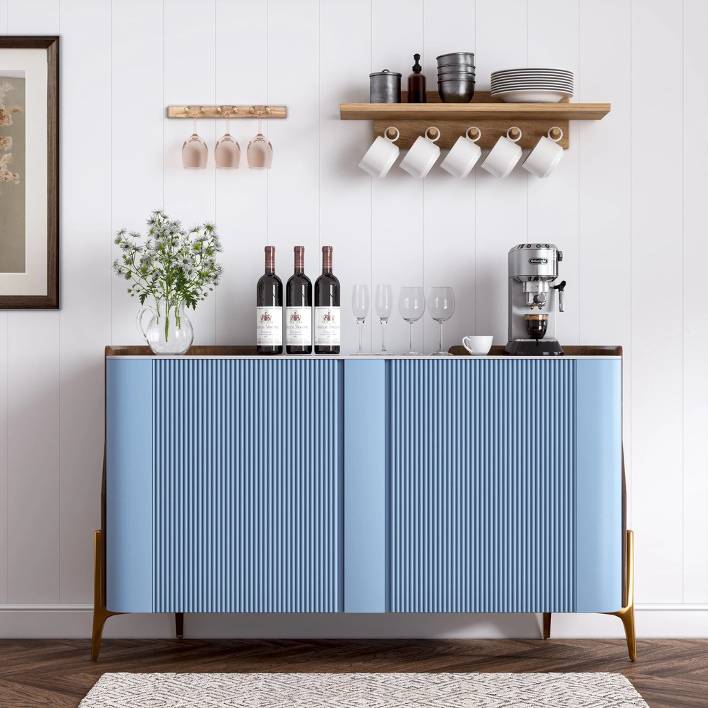 Light blue fluted sideboard with wood top, open shelving, white paneled wall, and coastal-inspired dining room decor.