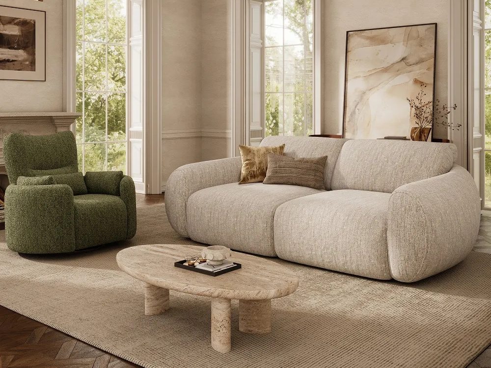 Mila-Power Sofa Bed with motorized functions near a swivel chair, an oval marble coffee table and a console table with a plant and a painting in a bright living room