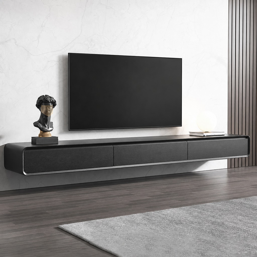Wall-mounted flat-screen TV above a long black floating TV stand with a bust sculpture, stacked books, and a globe lamp.